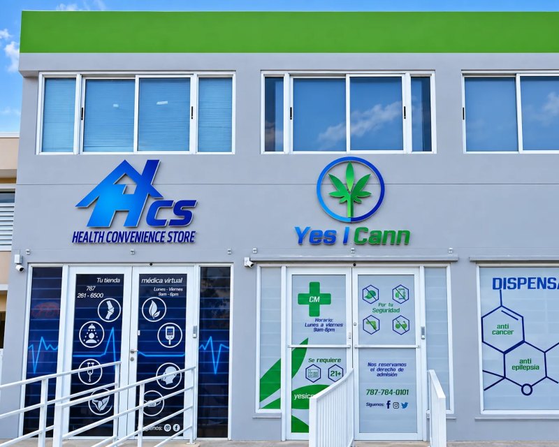 HCS and Yes I Cann storefront with wall logos and window graphics