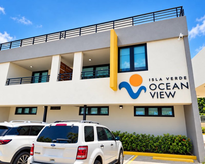 Ocean View Isla Verde logo and lettering on the white building facade