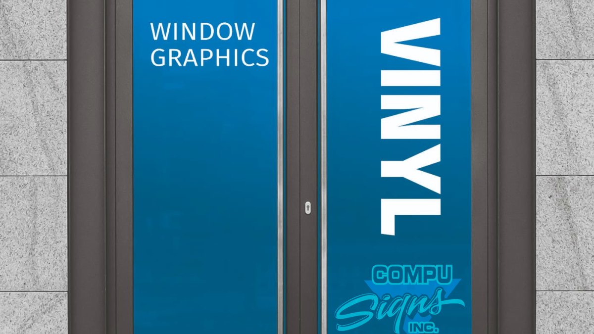 Storefront glass door covered with blue vinyl and «Window Graphics · Vinyl» lettering.